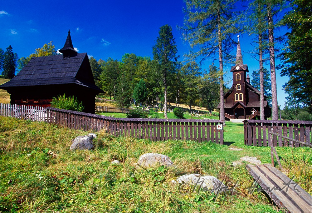 wooden church at the edge of the village