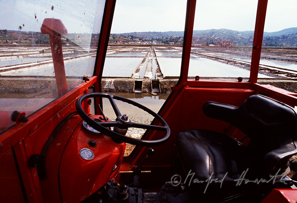 tractor and salt evaporation ponds