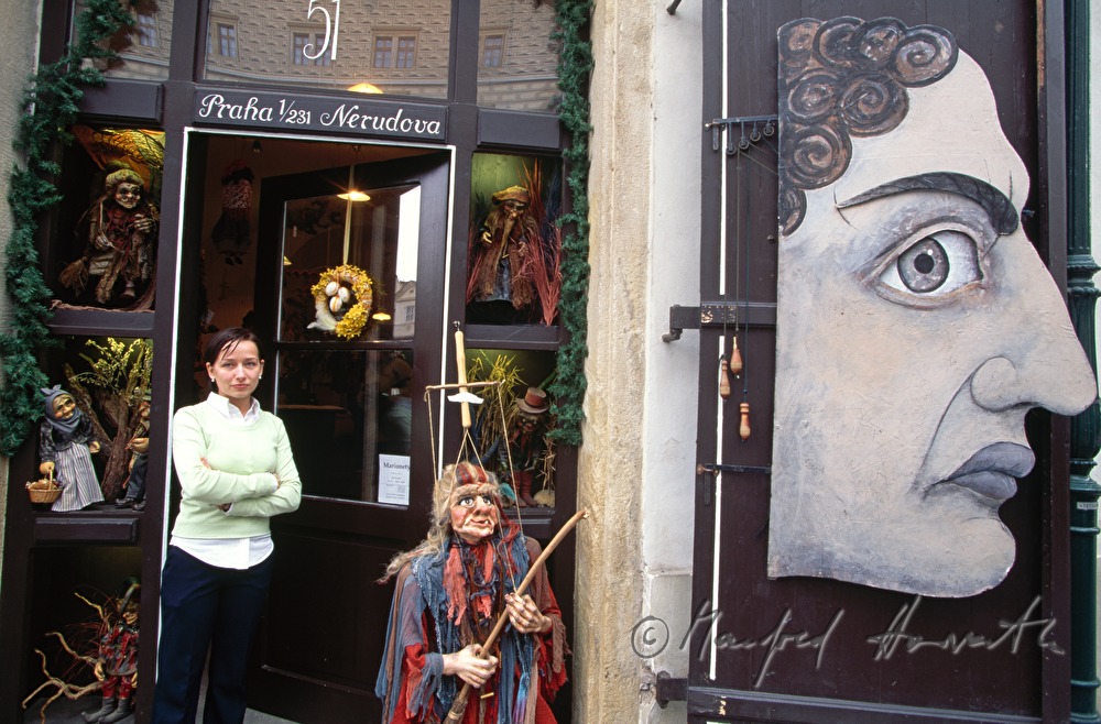 saleswoman in front of a puppet shop