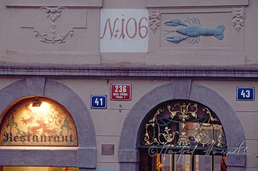 guild symbol over the entrance of a shop