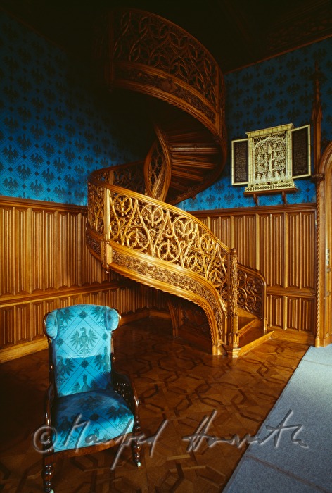 carved winding staircase in the library