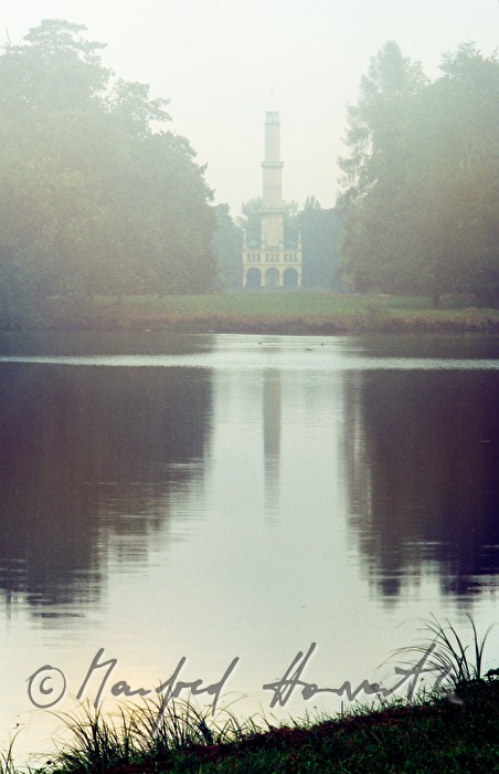 minaret on the shore of the pond