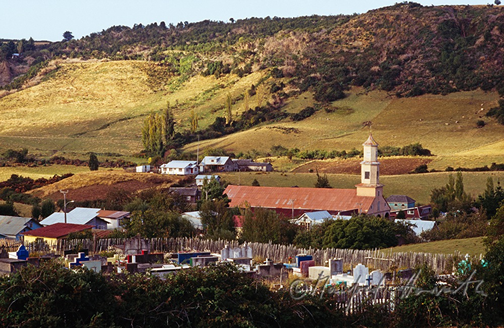 village cemetery and wooden church