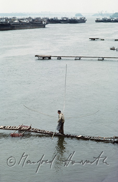 fishermen on a swimming pontoon