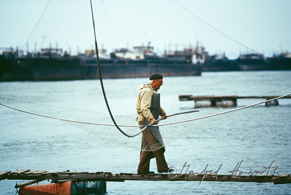 fishermen on a swimming pontoon