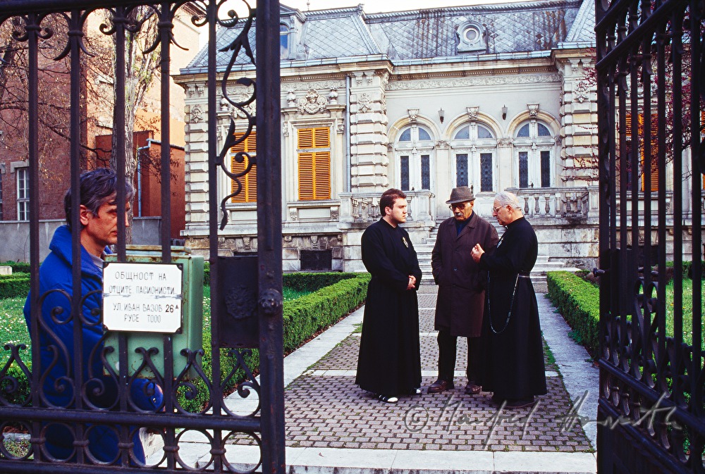 man talking to priests
