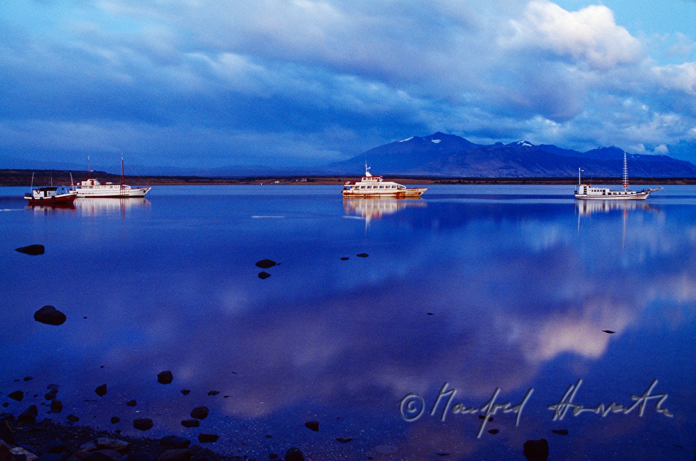 fishing boats in the harbour of Puerto Natales