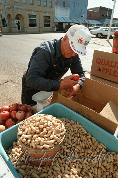 sidewalk sale of peanuts and apples