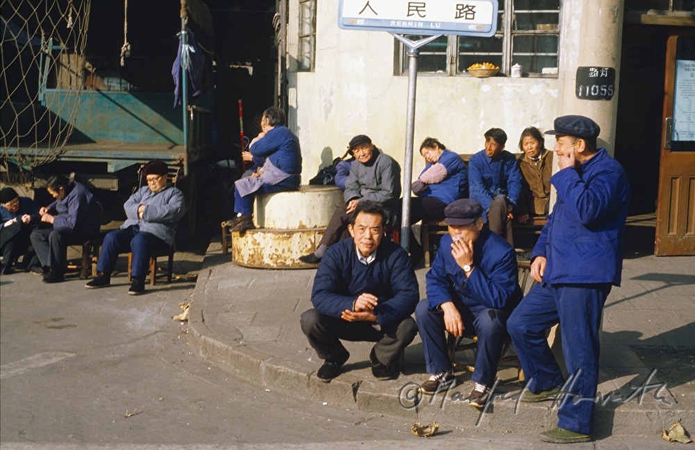 people in the street taking a sun bath