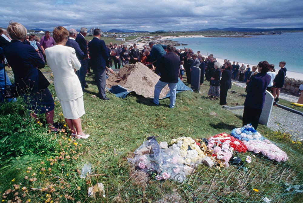 funeral on cemetery with ocean view