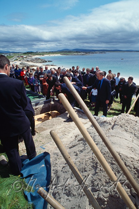 funeral on cemetery with ocean view