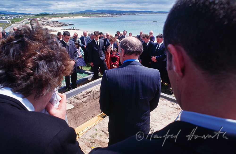 funeral on cemetery with ocean view