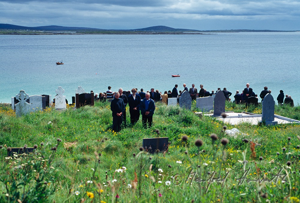 funeral on cemetery with ocean view