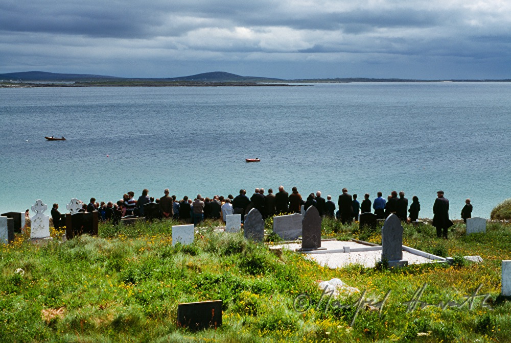 funeral on cemetery with ocean view