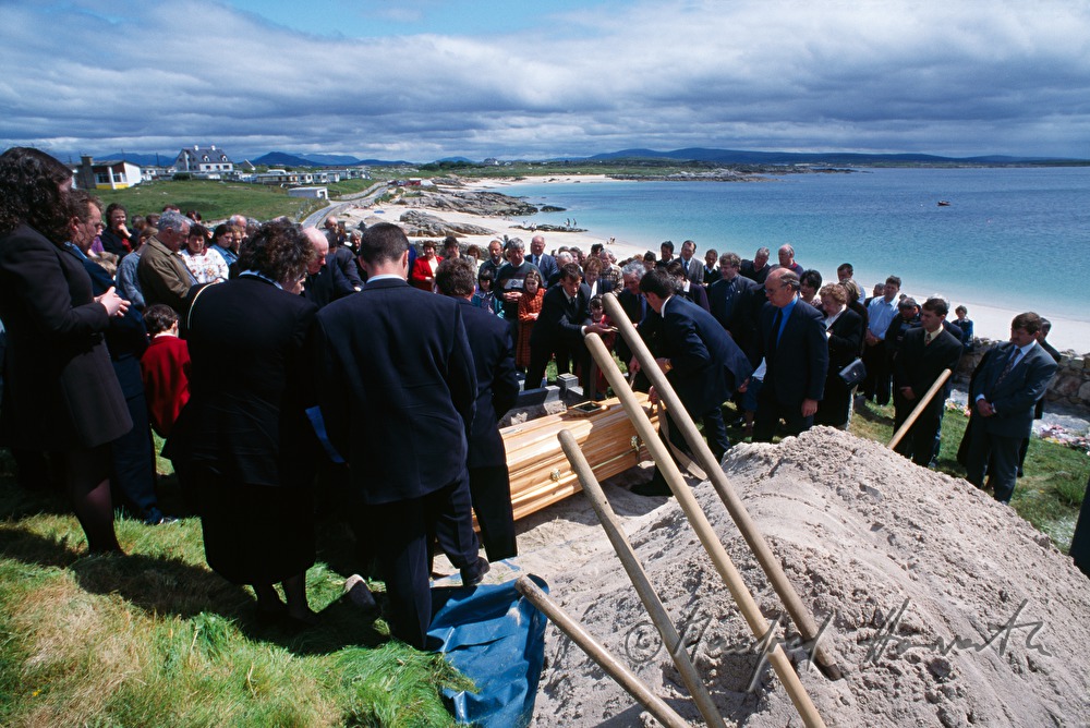 funeral on cemetery with ocean view