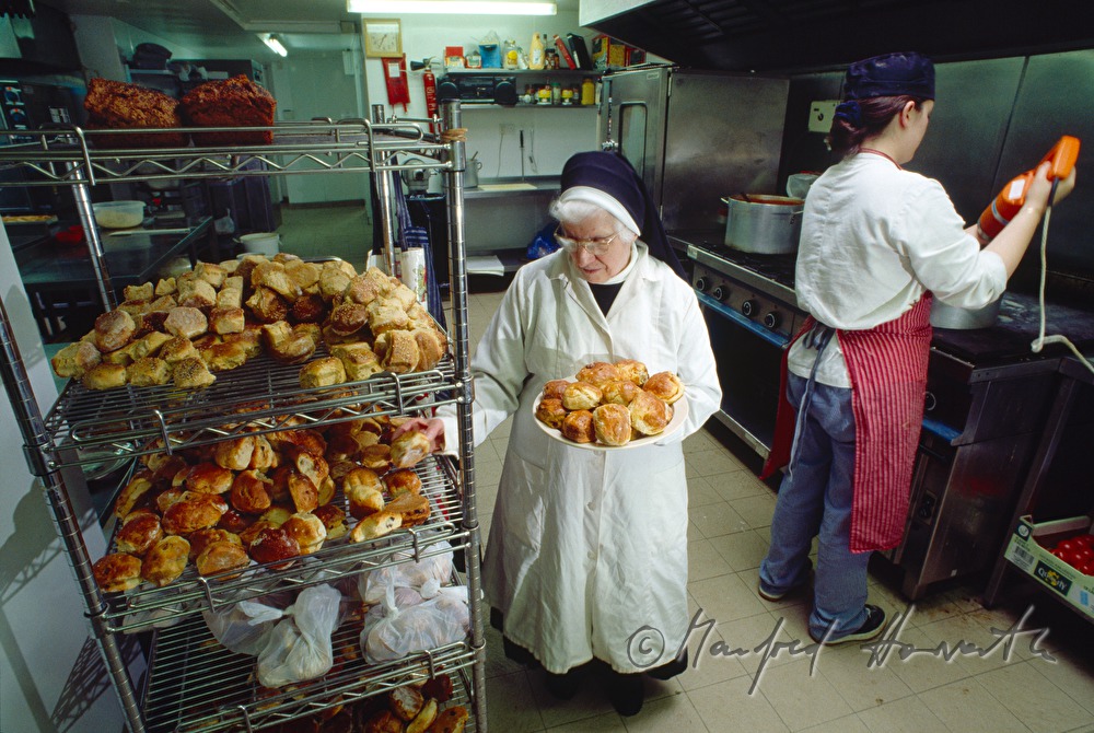 Benedictine nun in the bakery of the monastery