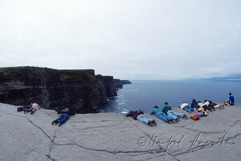 visitors look to the Atlantic Ocean