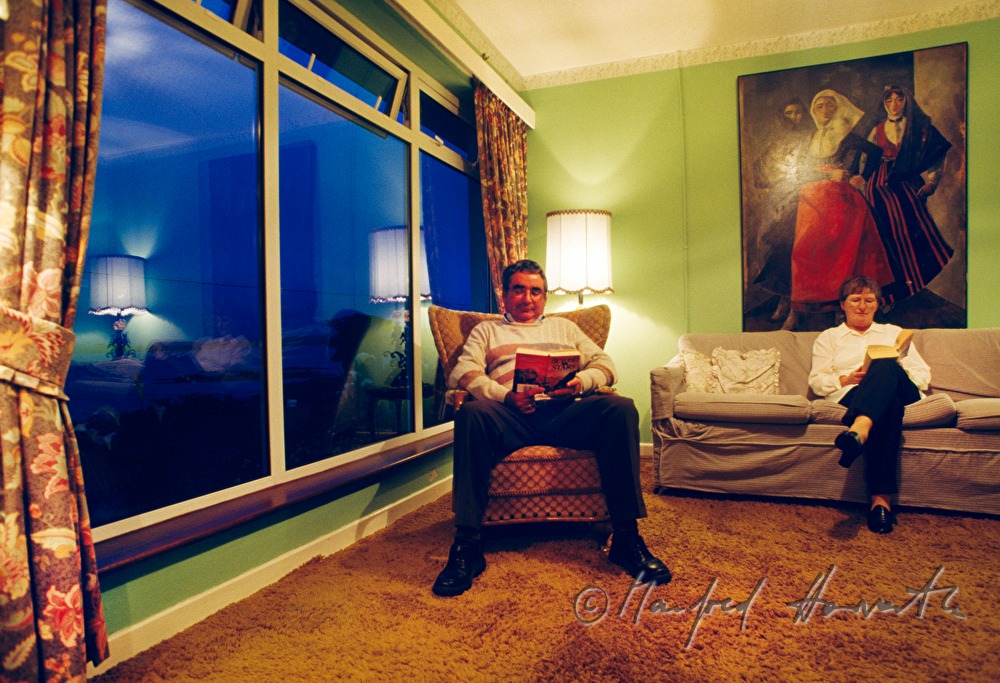 married couple reading in their living room