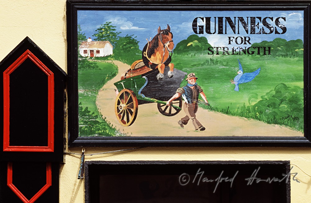 facade of a pub with advertising for 