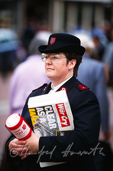 soldier of the Salvation Army with paper