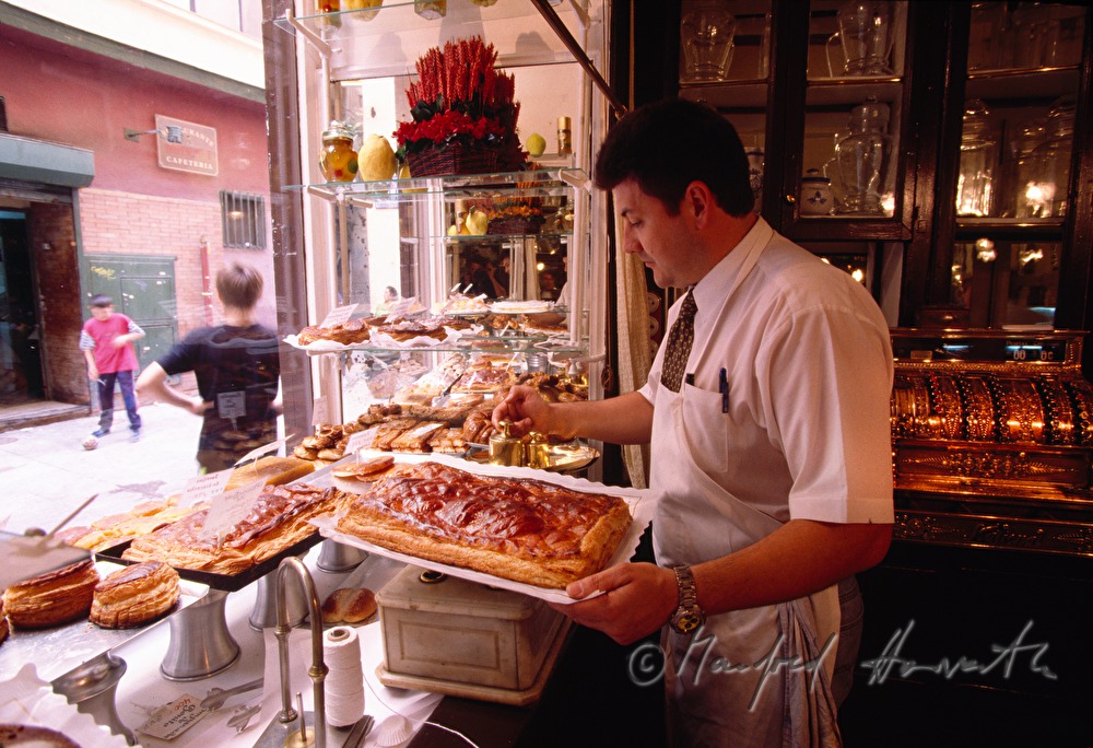 confectioner with sweets and soccer players