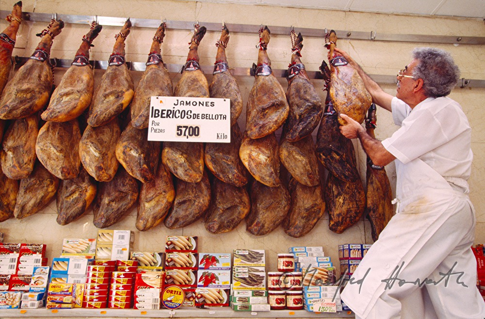 butcher with hams