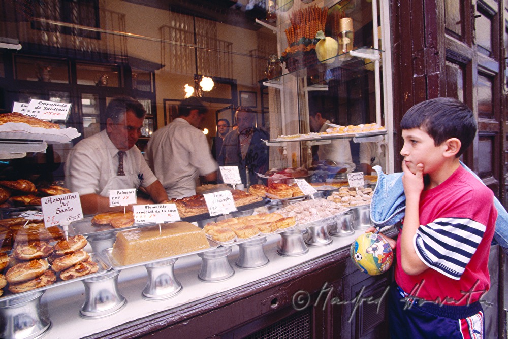 confectioner with sweets and soccer players