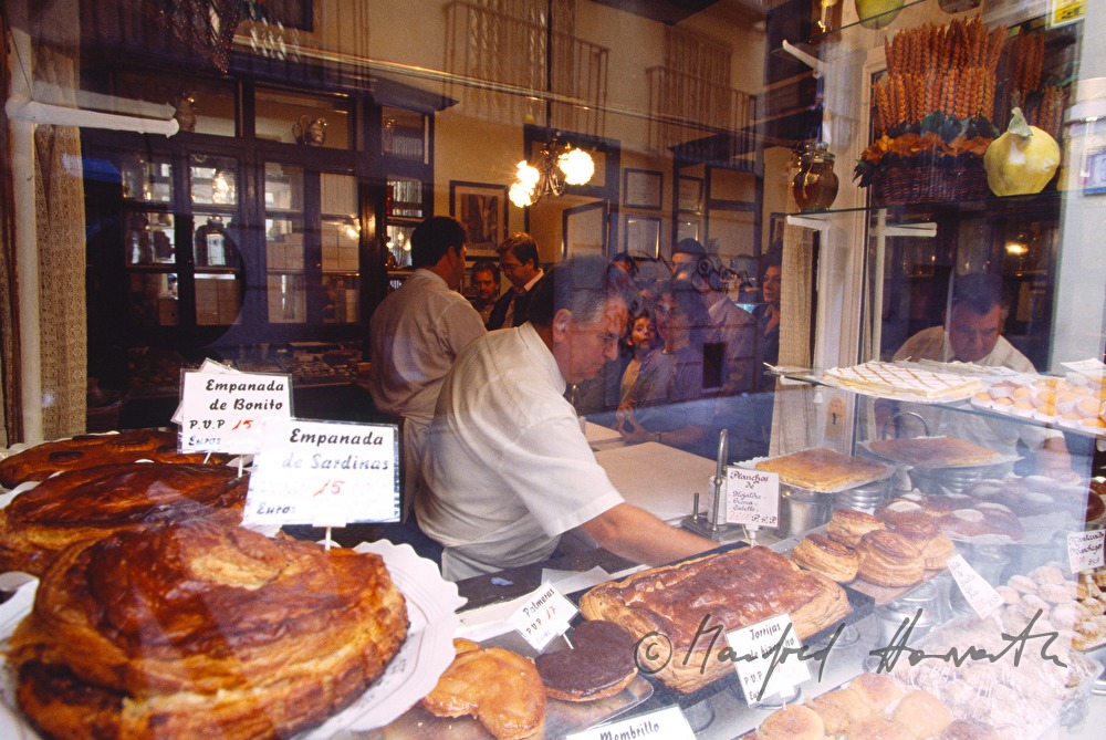 confectioner with sweets and soccer players