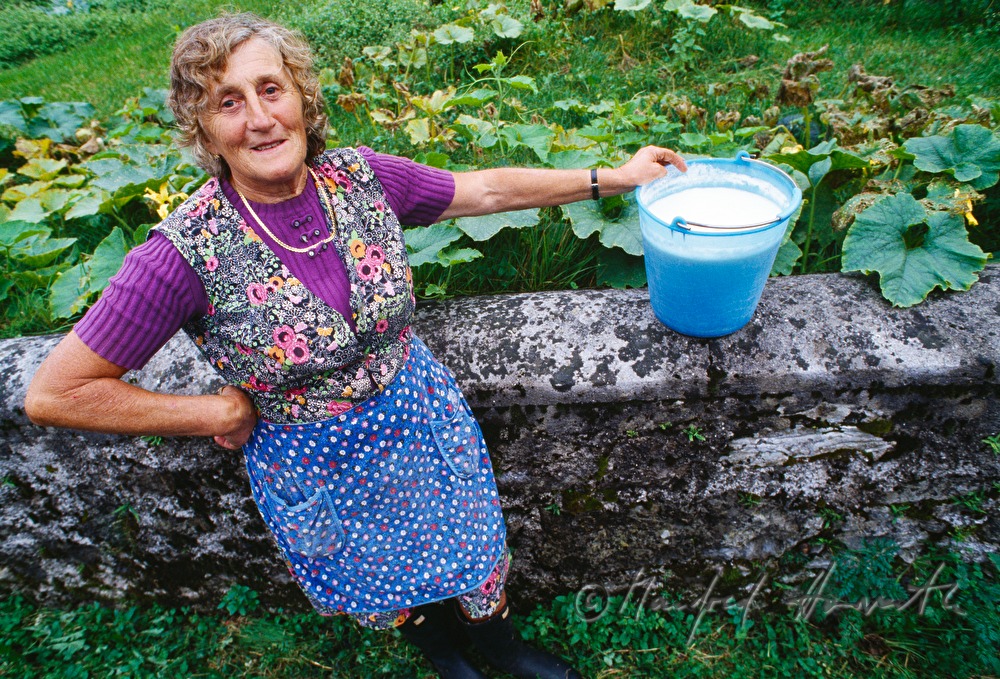 countrywoman with a bucket of milk