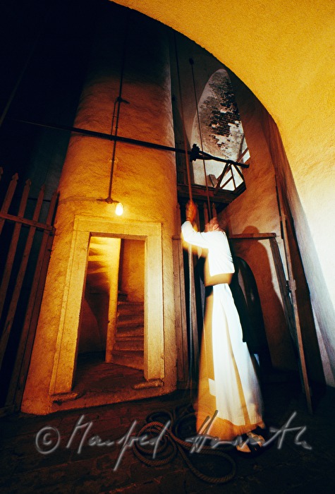 monk pulls the bells of monastery Zwettl
