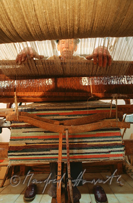 retired weaver on his loom