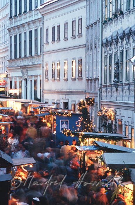 vendor stands at the christmas market baroque houses