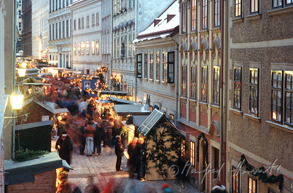 vendor stands at the christmas market baroque houses