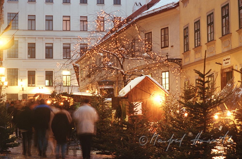vendor stands at the christmas market baroque houses