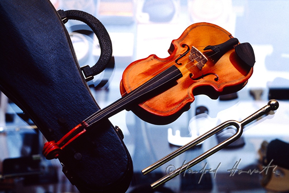 miniature of a violin and tuning fork