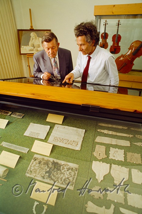 visitors inspect a show case