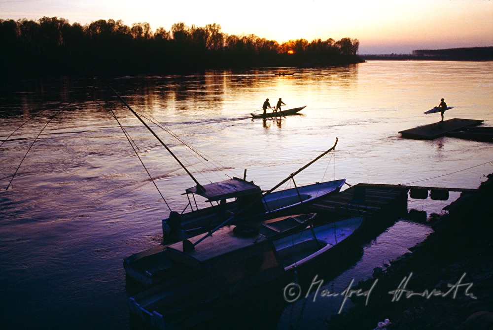 fishing boats, rowers and surfer