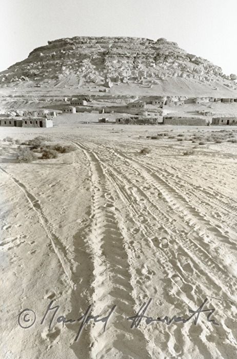 slot in the sand leading to the mesa