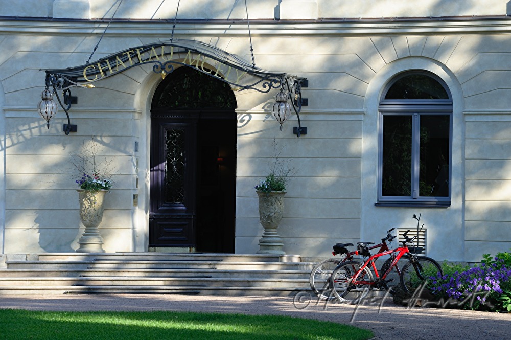 Chateau Mcely, main entrance and bicycle stand