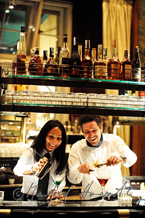 lady bartender and barkeeper mix drinks in the Laurin Bar