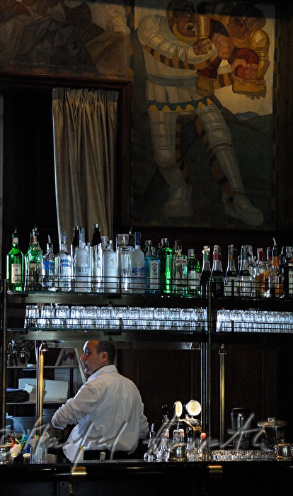 waiter in the bar preparing coffee