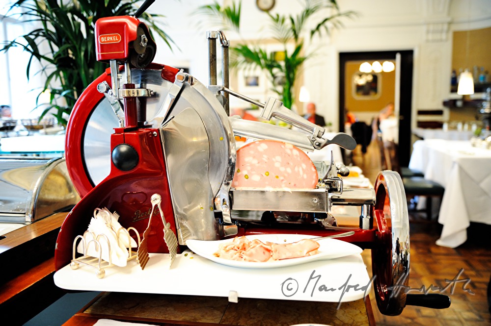 Mortadella slicing machine at breakfast