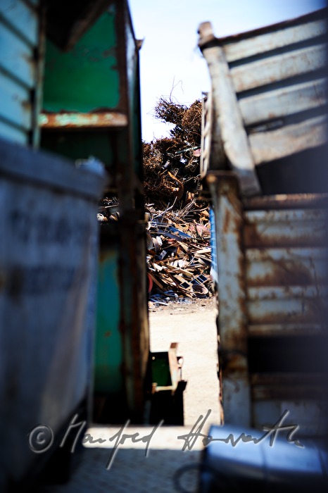 gripper loading metal scrap at a salvage yard