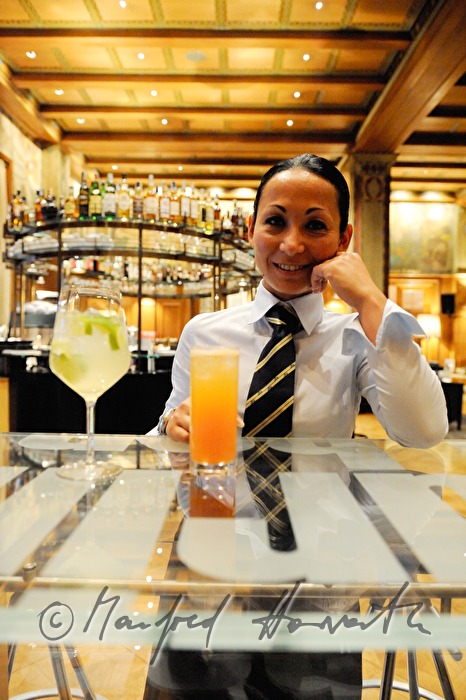 barmaid with a drink of hers in the Laurin Bar