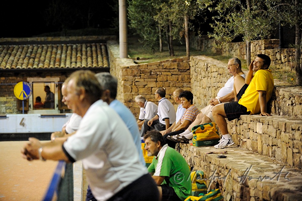 audience on the tribune watches a game