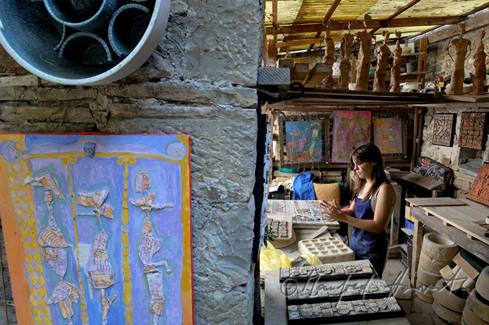 artist in her ceramic studio