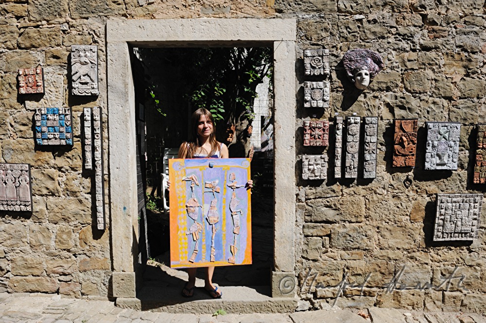 artist with ceramics art work