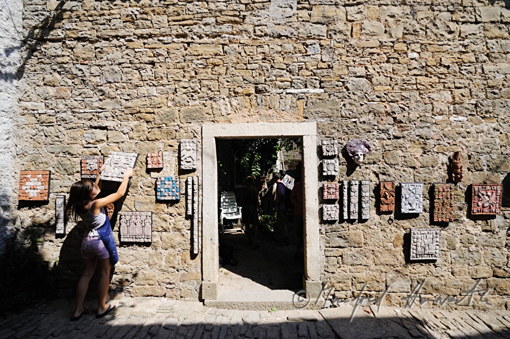artist with ceramics art work