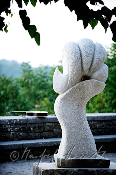 stone sculpture and guitar