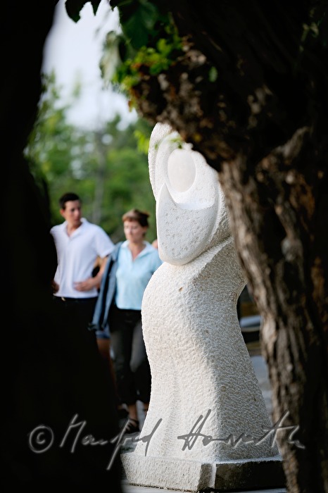 stone sculpture and walkers